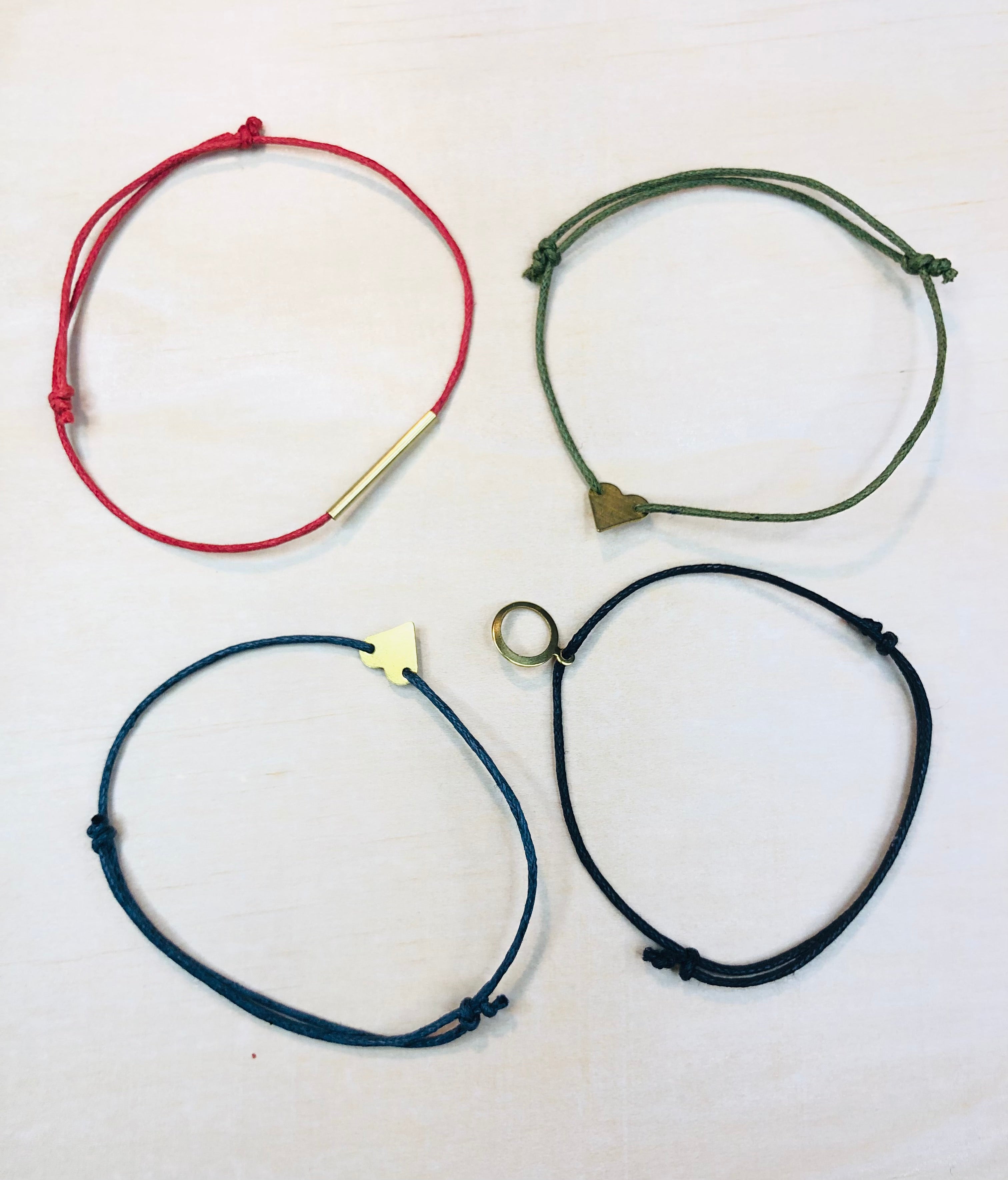 Friendship bracelet with brass charm