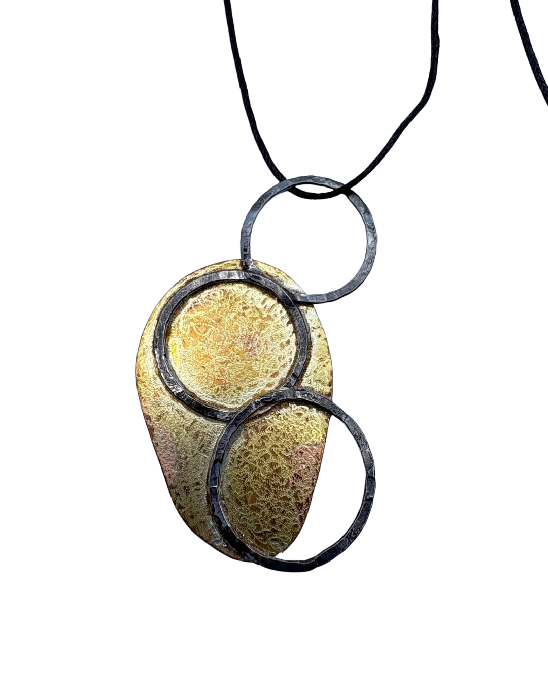 Oxidised silver and brass pendant on black string